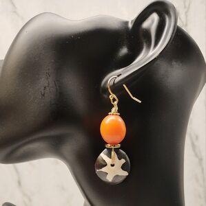 Handmade earrings with batik beads and resin amber bead.